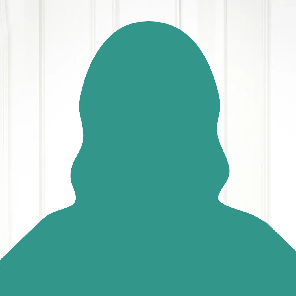 Eine türkise Silouette vor weißer Wand aus Holzdielen.